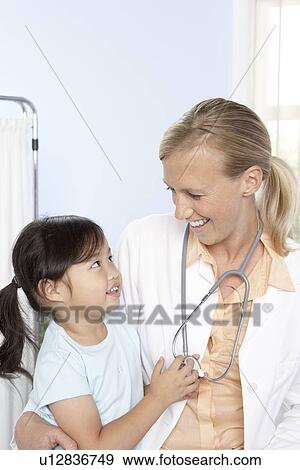 Doctor and child View Large Photo Image Stock Photo - Doctor and child. Fotosearch