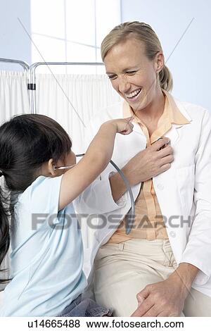 Doctor and child View Large Photo Image Stock Photo - Doctor and child. Fotosearch