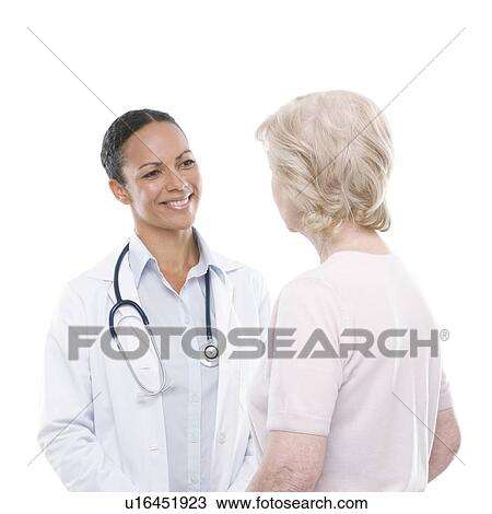 Stock Image - Doctor and senior woman. Fotosearch