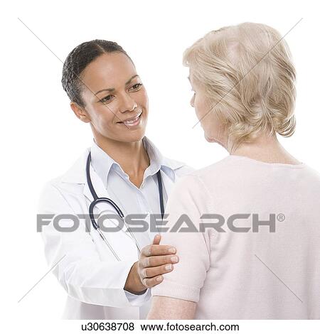 Doctor and senior woman View Large Photo Image Stock Photo - Doctor and senior woman. Fotosearch