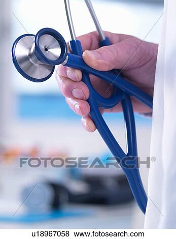 Doctor offering advice to a patient in a clinic View Large Photo Image Stock Photo - Doctor offering advice to a patient in a clinic. Fotosearch
