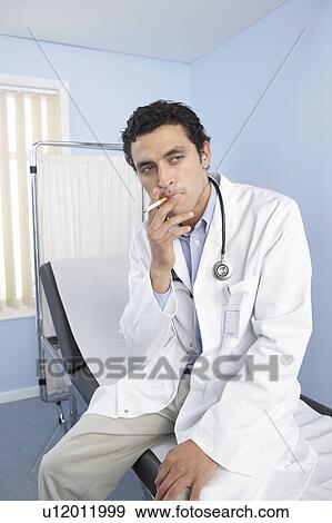Doctor smoking View Large Photo Image Stock Photo - Doctor smoking. Fotosearch