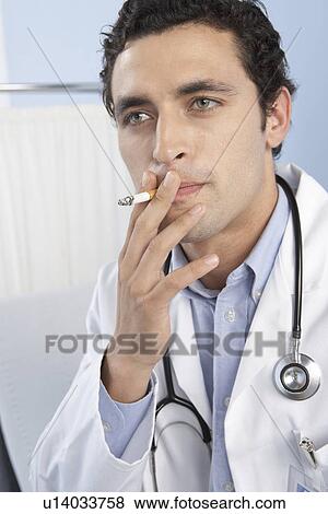 Doctor smoking View Large Photo Image Stock Photo - Doctor smoking. Fotosearch