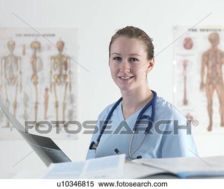 Doctor studying an X-ray View Large Photo Image Stock Photography - Doctor studying an X-ray. Fotosearch