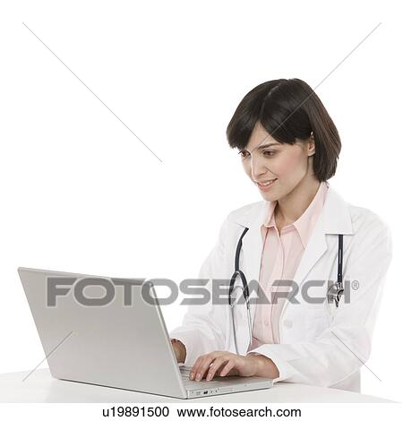 Doctor using a laptop View Large Photo Image Stock Image - Doctor using a laptop. Fotosearch