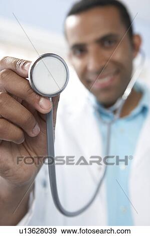 Stock Photo - Doctor using a stethoscope. Fotosearch
