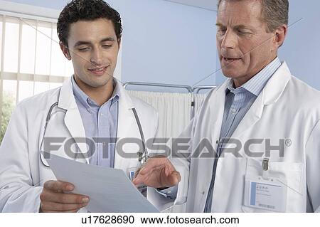 Stock Image - Doctors talking. Fotosearch