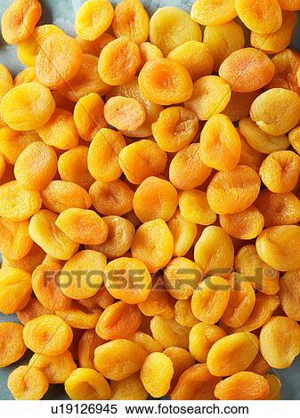 Stock Photography - Dried apricots, full frame, close-up. Fotosearch