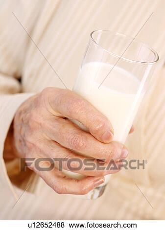 Stock Photo - Drinking milk. Fotosearch