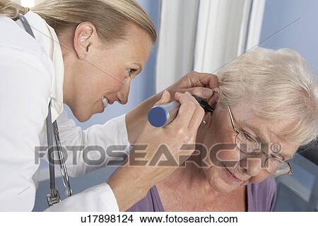 Picture - Ear examination. Fotosearch