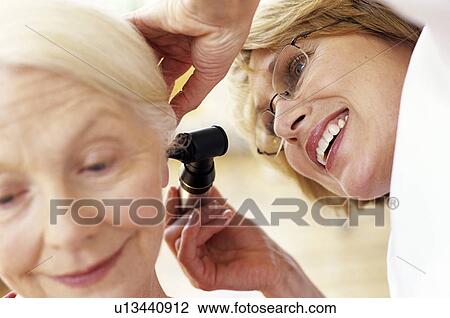 Stock Image - Ear examination. Fotosearch