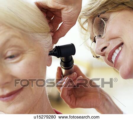 Stock Image - Ear examination. Fotosearch