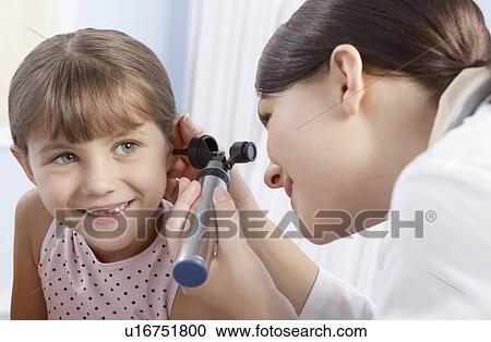 Stock Image - Ear examination. Fotosearch