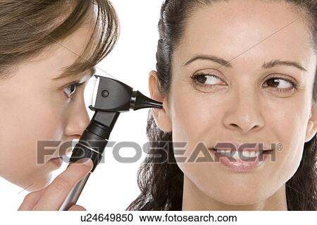 Stock Image - Ear examination. Fotosearch