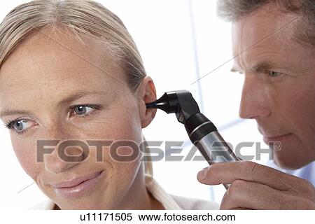 Ear examination View Large Photo Image Stock Photography - Ear examination. Fotosearch