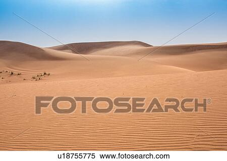 Empty desert landscape and blue sky, Dubai, United Arab Emirates View Large Photo Image Stock Photography - Empty desert landscape and blue sky, Dubai, United Arab Emirates. Fotosearch