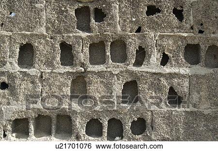 Stock Photograph - Eroded block wall. Fotosearch
