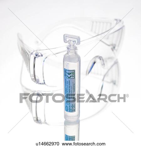 Stock Image - Eye wash pod and goggles. Fotosearch