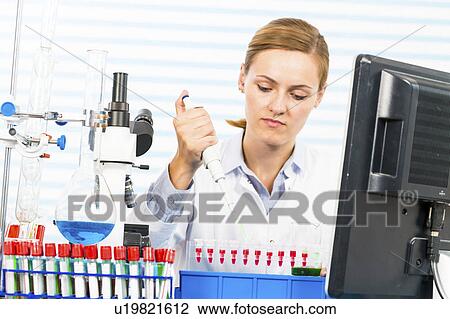 Female chemist using pipette in lab View Large Photo Image Stock Image - Female chemist using pipette in lab. Fotosearch