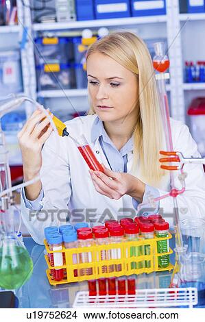 Female chemist working in lab View Large Photo Image Picture - Female chemist working in lab. Fotosearch