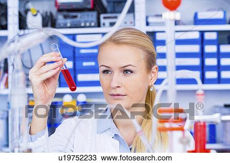 Female chemist working in lab View Large Photo Image Stock Image - Female chemist working in lab. Fotosearch