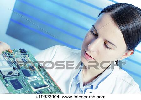 Female electrical engineer with circuit View Large Photo Image Picture - Female electrical engineer with circuit. Fotosearch