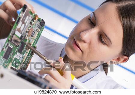 Female electrical engineer with circuit View Large Photo Image Stock Image - Female electrical engineer with circuit. Fotosearch