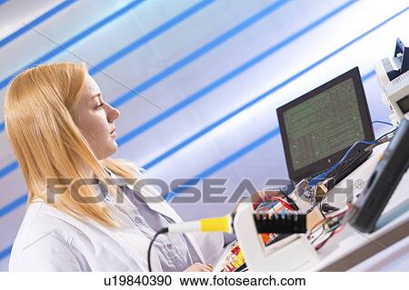 Female electrical engineer with computer View Large Photo Image Stock Image - Female electrical engineer with computer. Fotosearch