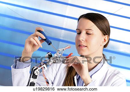 Stock Photograph - Female electrical engineer working. Fotosearch