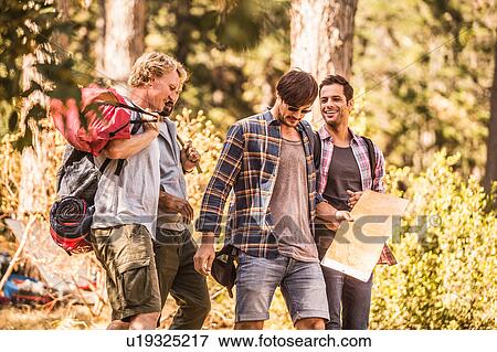Four male hikers hiking with map in forest, Deer Park, Cape Town, South Africa View Large Photo Image Stock Photo - Four male hikers hiking with map in forest, Deer Park, Cape Town, South Africa. Fotosearch
