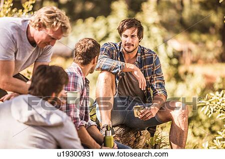 Four male hikers sitting in forest, Deer Park, Cape Town, South Africa View Large Photo Image Stock Image - Four male hikers sitting in forest, Deer Park, Cape Town, South Africa. Fotosearch