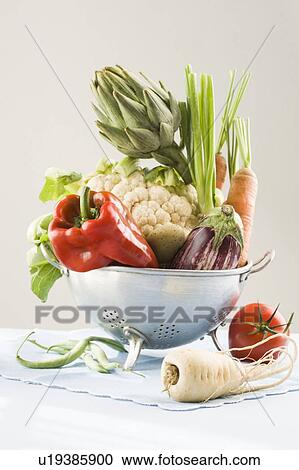 Stock Image - Fresh vegetables in a colander. Fotosearch