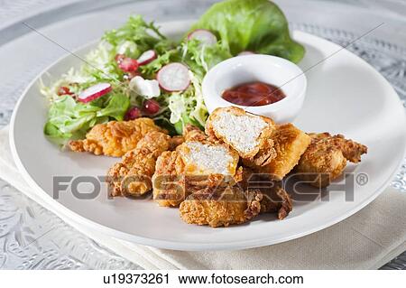 Fried chicken with salad and sauce View Large Photo Image Stock Image - Fried chicken with salad and sauce. Fotosearch