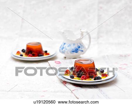Fruit jelly dessert with fresh fruit, on plate View Large Photo Image Stock Image - Fruit jelly dessert with fresh fruit, on plate. Fotosearch