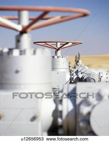 Stock Image - Gas well valves. Fotosearch