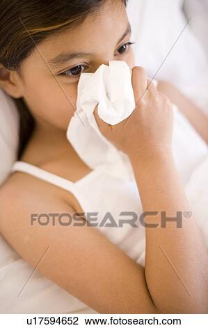 Girl blowing her nose View Large Photo Image Stock Image - Girl blowing her nose. Fotosearch