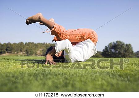 Stock Photography - Girl rolling forward. Fotosearch