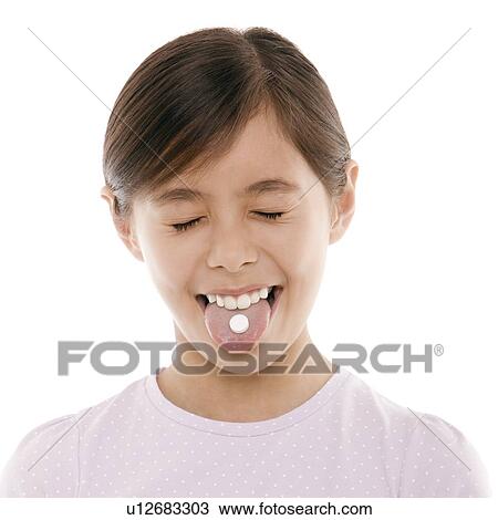 Stock Image - Girl taking painkiller. Fotosearch