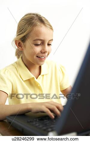 Stock Photo - Girl using a laptop computer. Fotosearch
