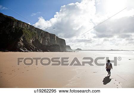 Girl walking on beach, Watergate Bay, Cornwall View Large Photo Image Stock Photography - Girl walking on beach, Watergate Bay, Cornwall. Fotosearch