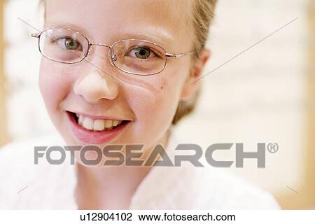 Stock Image - Girl wearing glasses. Fotosearch