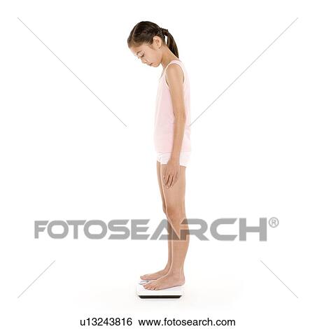 Girl weighing herself View Large Photo Image Stock Photograph - Girl weighing herself. Fotosearch