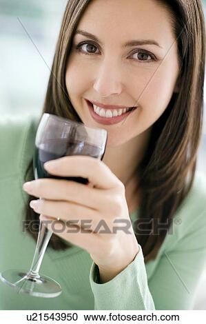Stock Image - Glass of red wine. Fotosearch