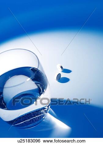 Stock Photograph - Glass of water and pills. Fotosearch