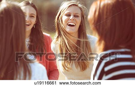 Group of female friends laughing View Large Photo Image Stock Image - Group of female friends laughing. Fotosearch
