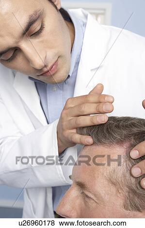 Hair transplant consultation View Large Photo Image Stock Photo - Hair transplant consultation. Fotosearch