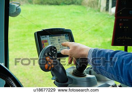 Hand of farmer using computer touchscreen in tractor View Large Photo Image Stock Photo - Hand of farmer using computer touchscreen in tractor. Fotosearch