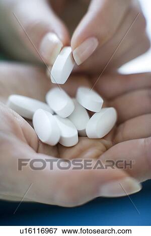 Stock Photo - Handful of pills. Fotosearch