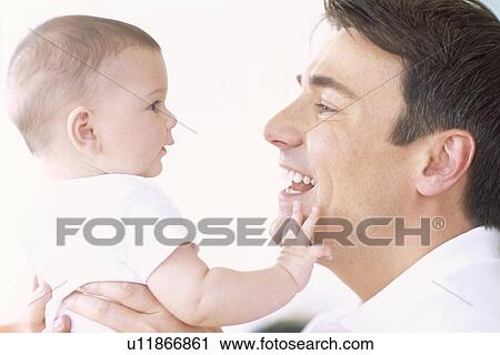 Stock Image - Happy father and baby girl. Fotosearch