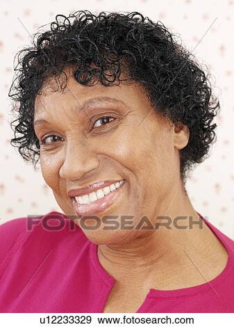 Stock Photo - Happy middle-aged woman. Fotosearch